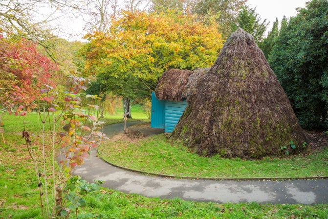The eighteenth century thatched ice house in the grounds at Scotney Castle, Kent